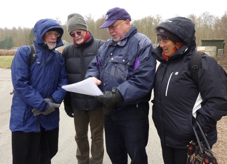 An icy archaeological excursion: Professor Erik Brinch Petersen (centre) explains his archaeological research into Mesolithic sites at Vedbaek, north of Copenhagen.