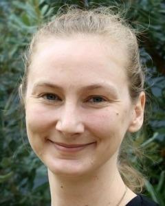 Photograph of Emily O&#039;Gorman with a leafy green background.
