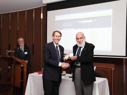 Ian Young hands ADB Medal to Geoffrey Bolton, 2012