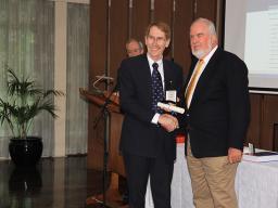 Ian Young hands ADB Medal to John Lack, 2012