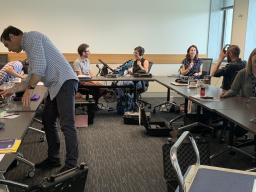 People at a table using audio equipment