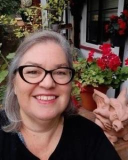 Photograph of Sharon Willoughby in her garden.