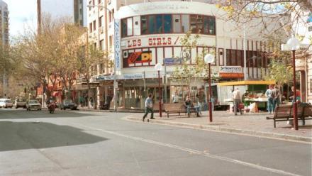 a streetscape showing a venue called Les Girls
